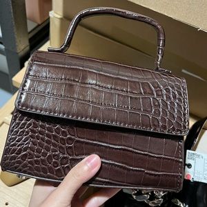 Mini top handle crossbody bag